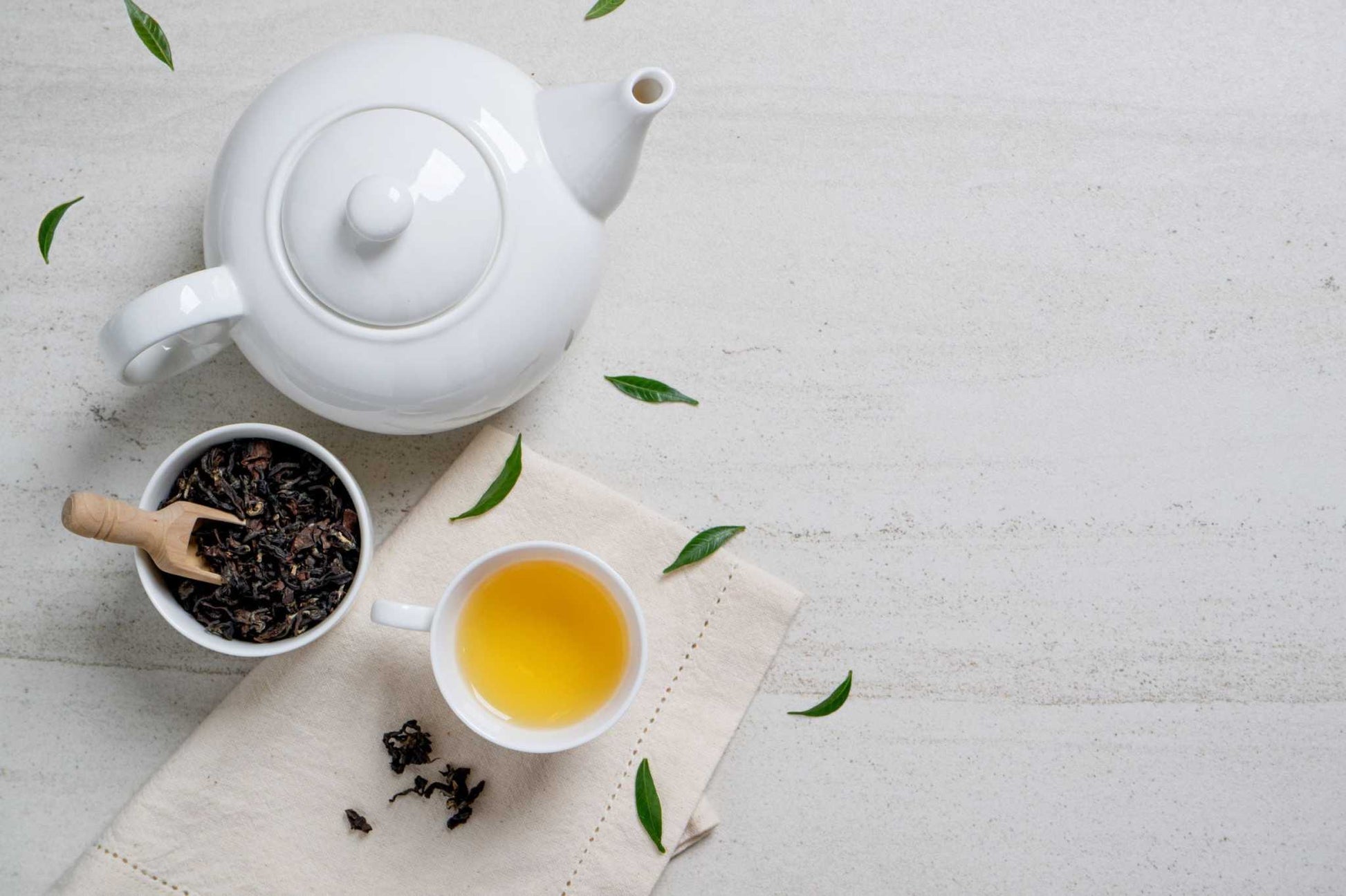 Shavuot Soursop Moringa Tea with teapot and brewed cup on a light background.
